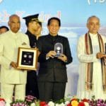 President releases commemorative coins on Nabakalebar festival