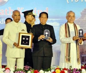 President releases commemorative coins on Nabakalebar festival