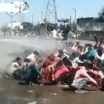 Sodium hypochlorite solution sprayed on migrants