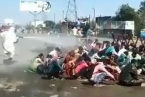 Sodium hypochlorite solution sprayed on migrants